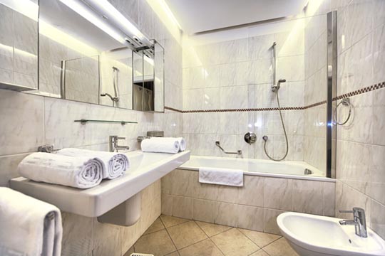 The Residence Brehova two bedroom apartment bathroom with bath