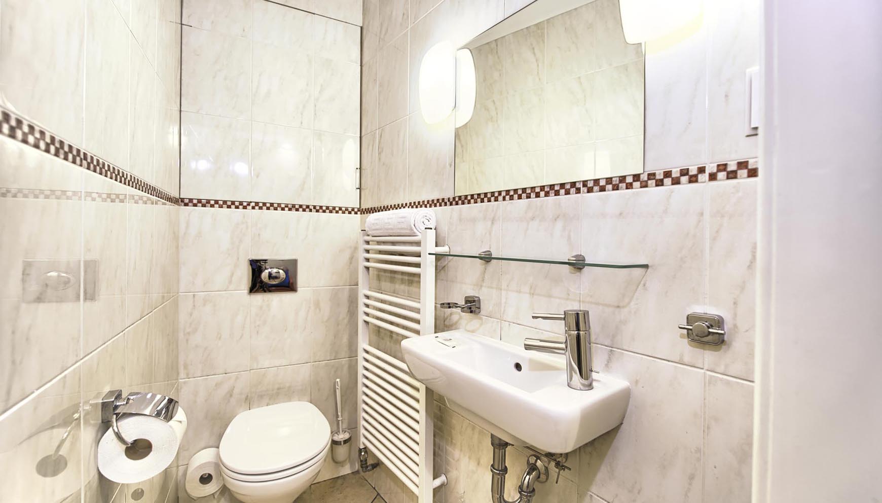 Third bathroom with extra toilet in a three bedroom apartment in Residence Brehova